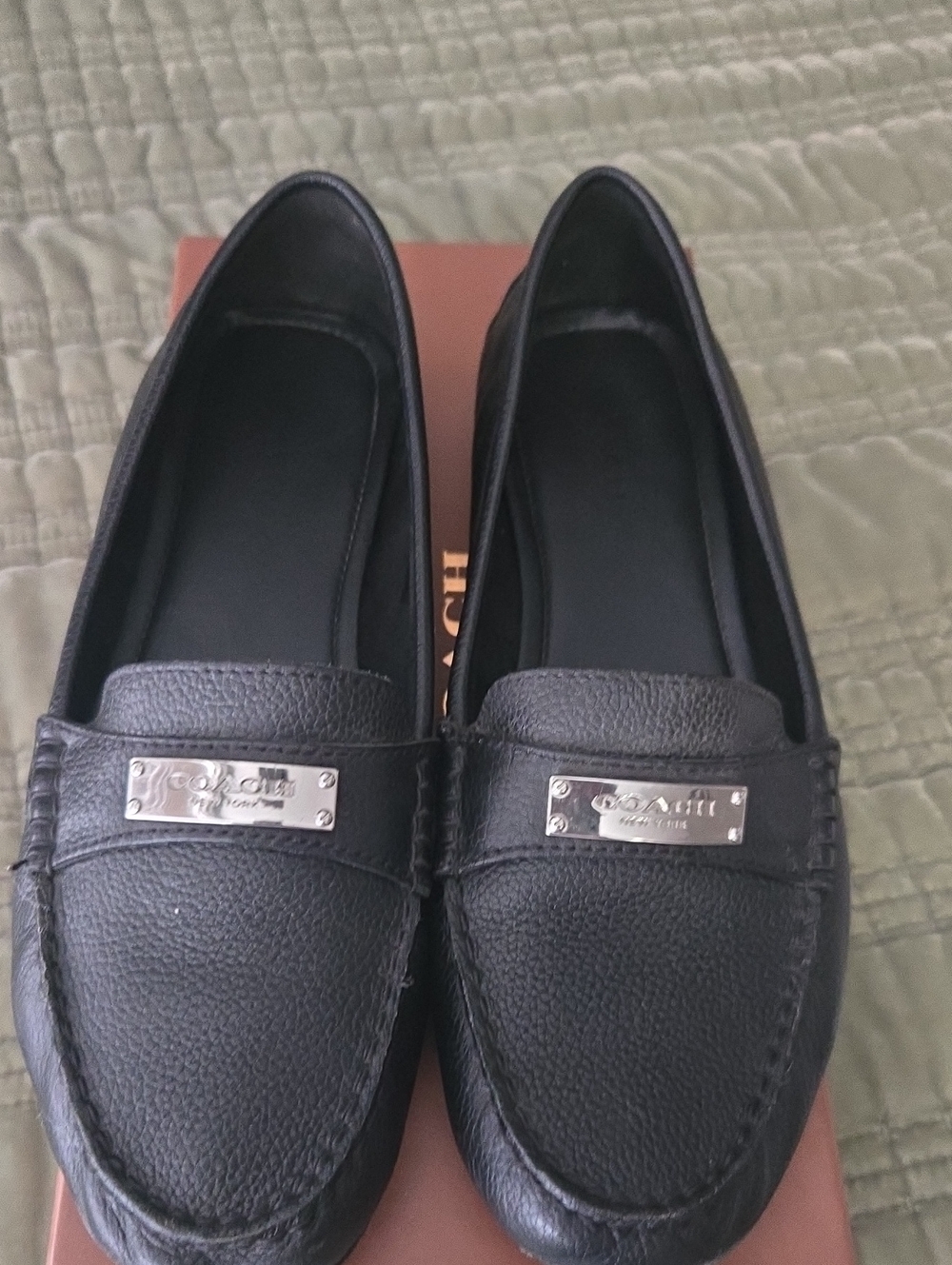Coach Black Leather Slip-On Loafers with Silver Plaque